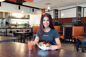 Fitness sensation Pauline DiGiorgio enjoys her own special creation: a spinach chicken ginger Cobb salad, complete with beets and broccoli. Her drink of choice is an apple cider green tea.