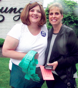 Jodi Deep, right, joins her friend Nicole Cocomazzi while buying raffle tickets at the cancer survivors breakfast at Hart’s Hill Inn in Whitesboro recently.