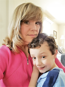 Kayci Visalli spends a tender moment with her autistic son, Isaiah.
