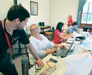 Adam Hobb, left, disaster program manager, chats with Jane Gendron, executive director of the North Country chapter of the American Red Cross and coordinator of the training classes held recently at the Utica Public Library. To Gendron’s left is Taylor Fanelli, who was keeping in touch with Red Cross officials in Texas in the aftermath of Hurricane Harvey.