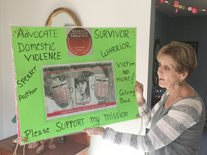 Barbara Joy Hansen displays her award-winning poster recognized during an Institute on Violence, Abuse & Trauma conference in San Diego, Calif. in 2012.