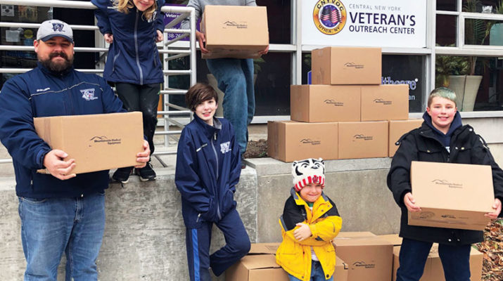 To celebrate Giving Tuesday, Mountainside Medical Equipment and players and coaches of the Whitestown Wolfpack Pee Wee Hockey team created special care packages and hygiene kits to distribute to local veterans at the Central New York Veteran’s Outreach Center in Utica. The Wolfpack assembled 150 kits of hygiene supplies for the Outreach Center, which operates a donation room that provides veterans and their families with necessary household items and medical supplies. The Whitestown Wolfpack, whose players are aged 10-12, regularly participate in charitable projects as a team. “It’s a chance for them to be part of something bigger than themselves and do it together,” said Wolfpack head coach Eric Gulseth. Mountainside Medical Equipment is a family owned and operated business, and maintains a regular presence in the community, including local youth hockey events in Central New York. The Central New York Veteran’s Outreach Center has been in operation since 2008 and is managed by the Utica Center for Development.