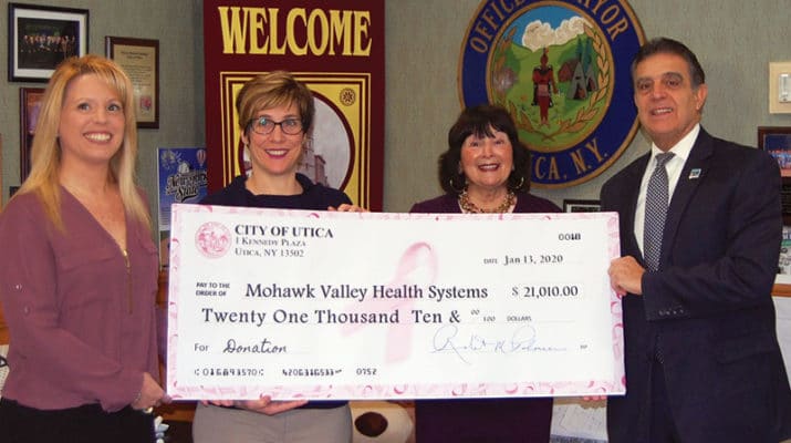 City of Utica Mayor Robert Palmieri, right, recently presented a check for more than $21,000 to the Mohawk Valley Health System Breast Care Center. The money was raised Palmieri’s annual breast cancer awareness luncheon that he hosts with his wife Susan. The guest speaker at this year’s luncheon was Shelley Penge, finance director at Utica Municipal Housing Authority, and a breast cancer survivor. The amount of funds raised this year is the greatest amount the luncheon has raised to date. Joining the mayor to celebrate are, from left, Patti DeCarr, senior administrative aide, urban and economic development, city of Utica; Nancy Butcher, executive director of cancer services at MVHS, and Susan Palmieri.