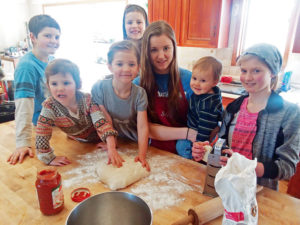 Brian and Brooke DeMott homeschool their children, which makes for a smooth transition to quarantine in the face of the COVID-19 pandemic. Above, the children partake in a “Life Skills” class, making pizza from scratch. They are, from left, Judah, 10; Miriam, 3; Selah, 5; Malachi, 7; Stacia, 15; Enoch, 1; and Aliana, 11.