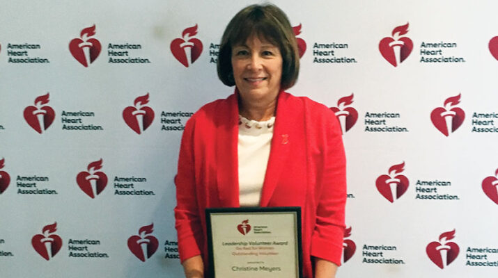 Christine Meyers of Clinton receives recognition at the American Heart Association’s “Go Red For Women” luncheon.
